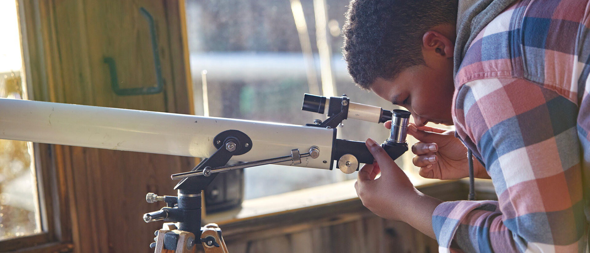 Student using a telescope